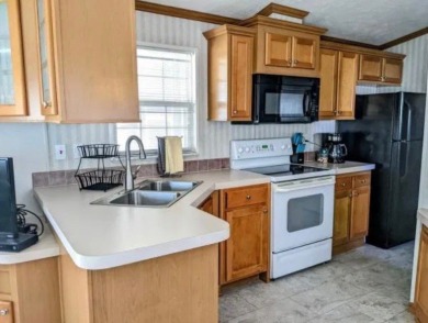 Immaculate newly updated Champion park model is ready for next on Clerbrook Resort, Inc. in Florida - for sale on GolfHomes.com, golf home, golf lot