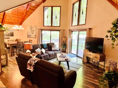 This open concept chalet home is nestled in the woods of Alpine on Alpine Lake Resort in West Virginia - for sale on GolfHomes.com, golf home, golf lot