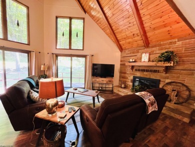 This open concept chalet home is nestled in the woods of Alpine on Alpine Lake Resort in West Virginia - for sale on GolfHomes.com, golf home, golf lot