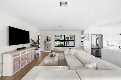 Experience resort-style living in this beautifully renovated on Quail Ridge Golf Course and Country Club in Florida - for sale on GolfHomes.com, golf home, golf lot