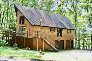 This open concept chalet home is nestled in the woods of Alpine on Alpine Lake Resort in West Virginia - for sale on GolfHomes.com, golf home, golf lot