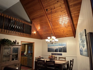 This open concept chalet home is nestled in the woods of Alpine on Alpine Lake Resort in West Virginia - for sale on GolfHomes.com, golf home, golf lot