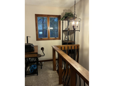 This open concept chalet home is nestled in the woods of Alpine on Alpine Lake Resort in West Virginia - for sale on GolfHomes.com, golf home, golf lot