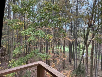 This open concept chalet home is nestled in the woods of Alpine on Alpine Lake Resort in West Virginia - for sale on GolfHomes.com, golf home, golf lot