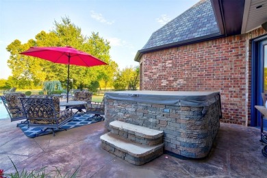 Stunning 5-bedroom, 5-bathroom home with 5,624 square feet of on Oak Tree National Golf and Country Club in Oklahoma - for sale on GolfHomes.com, golf home, golf lot