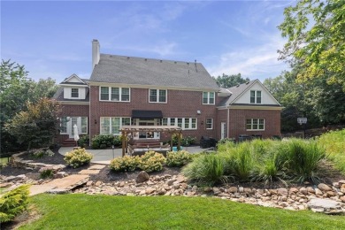 Custom built home on private, large, treed lot with lake views on Loch Lloyd Country Club in Missouri - for sale on GolfHomes.com, golf home, golf lot