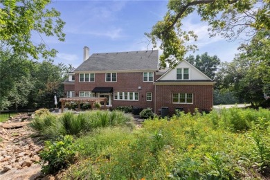 Custom built home on private, large, treed lot with lake views on Loch Lloyd Country Club in Missouri - for sale on GolfHomes.com, golf home, golf lot