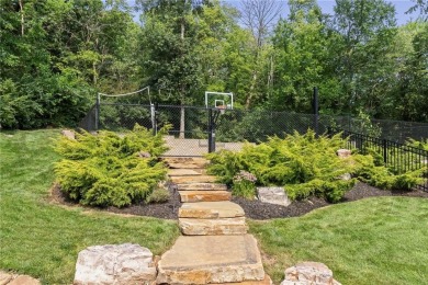 Custom built home on private, large, treed lot with lake views on Loch Lloyd Country Club in Missouri - for sale on GolfHomes.com, golf home, golf lot