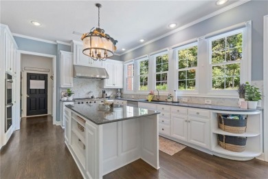 Custom built home on private, large, treed lot with lake views on Loch Lloyd Country Club in Missouri - for sale on GolfHomes.com, golf home, golf lot