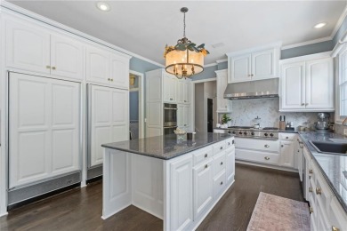 Custom built home on private, large, treed lot with lake views on Loch Lloyd Country Club in Missouri - for sale on GolfHomes.com, golf home, golf lot