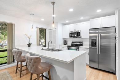 Come see this gorgeous CORNER END UNIT Golf Villa overlooking on PGA National Golf Club in Florida - for sale on GolfHomes.com, golf home, golf lot