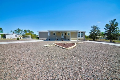 Welcome to your dream abode, nestled on a desirable corner lot on Brookridge Country Club in Florida - for sale on GolfHomes.com, golf home, golf lot