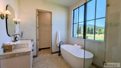 Positioned on the 18th green of the prestigious Teton Springs on Teton Springs Resort and Club in Idaho - for sale on GolfHomes.com, golf home, golf lot