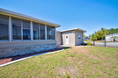 Welcome to your dream abode, nestled on a desirable corner lot on Brookridge Country Club in Florida - for sale on GolfHomes.com, golf home, golf lot