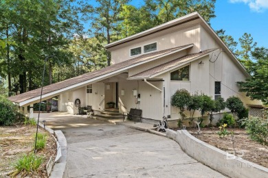 The bedroom upstairs has a private bath, whirlpool tub, shower on Lake Forest Yacht and Country Club in Alabama - for sale on GolfHomes.com, golf home, golf lot