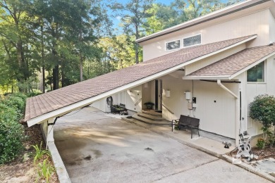 The bedroom upstairs has a private bath, whirlpool tub, shower on Lake Forest Yacht and Country Club in Alabama - for sale on GolfHomes.com, golf home, golf lot