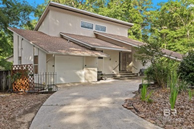 The bedroom upstairs has a private bath, whirlpool tub, shower on Lake Forest Yacht and Country Club in Alabama - for sale on GolfHomes.com, golf home, golf lot