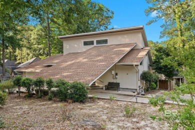 The bedroom upstairs has a private bath, whirlpool tub, shower on Lake Forest Yacht and Country Club in Alabama - for sale on GolfHomes.com, golf home, golf lot