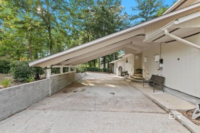 The bedroom upstairs has a private bath, whirlpool tub, shower on Lake Forest Yacht and Country Club in Alabama - for sale on GolfHomes.com, golf home, golf lot