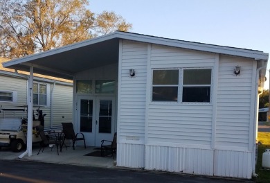 ONE BEDROOM , ONE BATH WITH FULL ADDITION ALL SEASON ROOM. THIS on Silver Dollar Golf and Trap Club in Florida - for sale on GolfHomes.com, golf home, golf lot