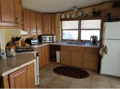 ONE BEDROOM , ONE BATH WITH FULL ADDITION ALL SEASON ROOM. THIS on Silver Dollar Golf and Trap Club in Florida - for sale on GolfHomes.com, golf home, golf lot