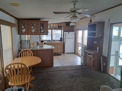 ONE BEDROOM , ONE BATH WITH FULL ADDITION ALL SEASON ROOM. THIS on Silver Dollar Golf and Trap Club in Florida - for sale on GolfHomes.com, golf home, golf lot
