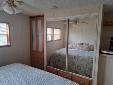 ONE BEDROOM , ONE BATH WITH FULL ADDITION ALL SEASON ROOM. THIS on Silver Dollar Golf and Trap Club in Florida - for sale on GolfHomes.com, golf home, golf lot