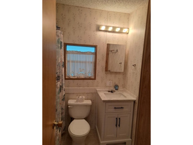 ONE BEDROOM , ONE BATH WITH FULL ADDITION ALL SEASON ROOM. THIS on Silver Dollar Golf and Trap Club in Florida - for sale on GolfHomes.com, golf home, golf lot