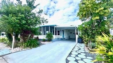 This charming 2-bedroom, 1.5-bath manufactured home offers on Riverbend Golf and Country Club in Florida - for sale on GolfHomes.com, golf home, golf lot