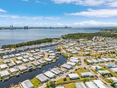 This charming 2-bedroom, 1.5-bath manufactured home offers on Riverbend Golf and Country Club in Florida - for sale on GolfHomes.com, golf home, golf lot