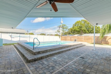 Welcome to this stunning 2-bedroom, 2-bathroom pool home located on Daytona Beach Golf Club in Florida - for sale on GolfHomes.com, golf home, golf lot