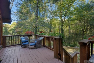 Nestled on a sprawling private lot, this enchanting on Sapphire National Golf Club in North Carolina - for sale on GolfHomes.com, golf home, golf lot