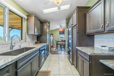 Wide-open space, mountain views, and room to breathe welcome to on Los Lagos Golf Club in Arizona - for sale on GolfHomes.com, golf home, golf lot