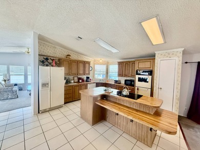 Home is located in Water Oak Country Club Estates, an active 55 on Water Oak Country Club Estates in Florida - for sale on GolfHomes.com, golf home, golf lot