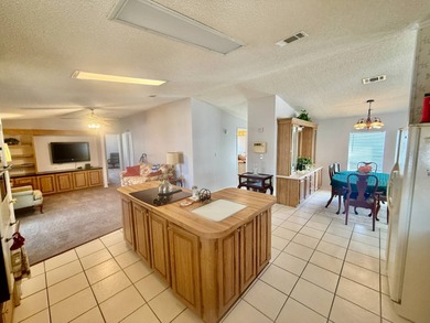 Home is located in Water Oak Country Club Estates, an active 55 on Water Oak Country Club Estates in Florida - for sale on GolfHomes.com, golf home, golf lot