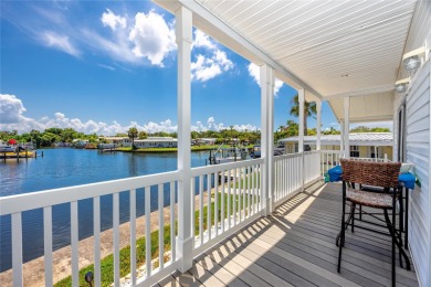Experience the best of Florida living in this beautifully on Mangrove Bay Golf Course in Florida - for sale on GolfHomes.com, golf home, golf lot