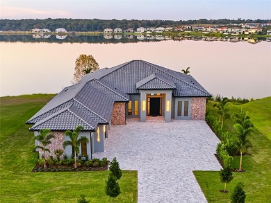 A contemporary Mediterranean lakefront masterpiece, this on Bella Collina Golf Club in Florida - for sale on GolfHomes.com, golf home, golf lot
