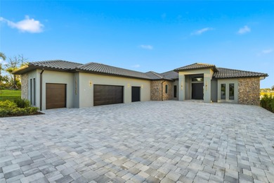 A contemporary Mediterranean lakefront masterpiece, this on Bella Collina Golf Club in Florida - for sale on GolfHomes.com, golf home, golf lot