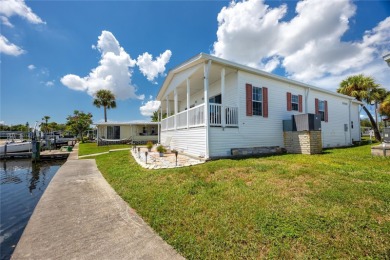Experience the best of Florida living in this beautifully on Mangrove Bay Golf Course in Florida - for sale on GolfHomes.com, golf home, golf lot