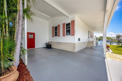 Experience the best of Florida living in this beautifully on Mangrove Bay Golf Course in Florida - for sale on GolfHomes.com, golf home, golf lot
