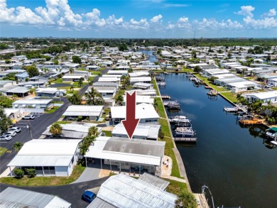 Experience the best of Florida living in this beautifully on Mangrove Bay Golf Course in Florida - for sale on GolfHomes.com, golf home, golf lot