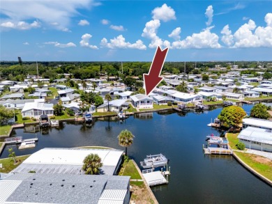 Experience the best of Florida living in this beautifully on Mangrove Bay Golf Course in Florida - for sale on GolfHomes.com, golf home, golf lot