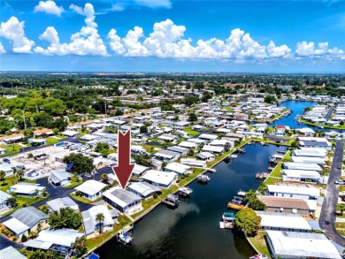 Experience the best of Florida living in this beautifully on Mangrove Bay Golf Course in Florida - for sale on GolfHomes.com, golf home, golf lot