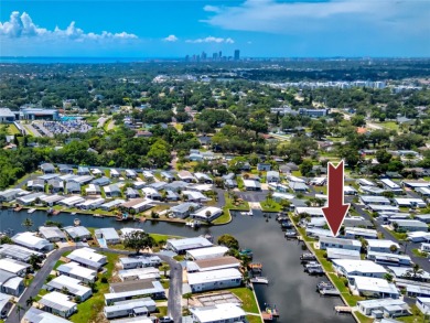 Experience the best of Florida living in this beautifully on Mangrove Bay Golf Course in Florida - for sale on GolfHomes.com, golf home, golf lot