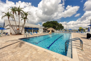 Experience the best of Florida living in this beautifully on Mangrove Bay Golf Course in Florida - for sale on GolfHomes.com, golf home, golf lot