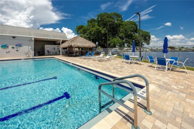 Experience the best of Florida living in this beautifully on Mangrove Bay Golf Course in Florida - for sale on GolfHomes.com, golf home, golf lot