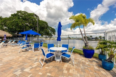Experience the best of Florida living in this beautifully on Mangrove Bay Golf Course in Florida - for sale on GolfHomes.com, golf home, golf lot