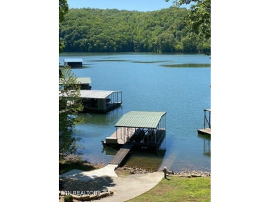 Beautiful lakefront basement/ranch home with plenty of space on The Greens at Deerfield in Tennessee - for sale on GolfHomes.com, golf home, golf lot