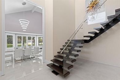 Nestled within the prestigious Wellington Aero Club on a quiet on The Wanderers Club in Florida - for sale on GolfHomes.com, golf home, golf lot