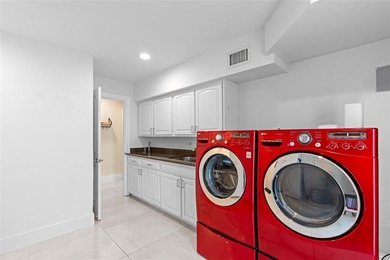 Nestled within the prestigious Wellington Aero Club on a quiet on The Wanderers Club in Florida - for sale on GolfHomes.com, golf home, golf lot